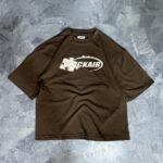 REMERA PUZZLE (MARRON)